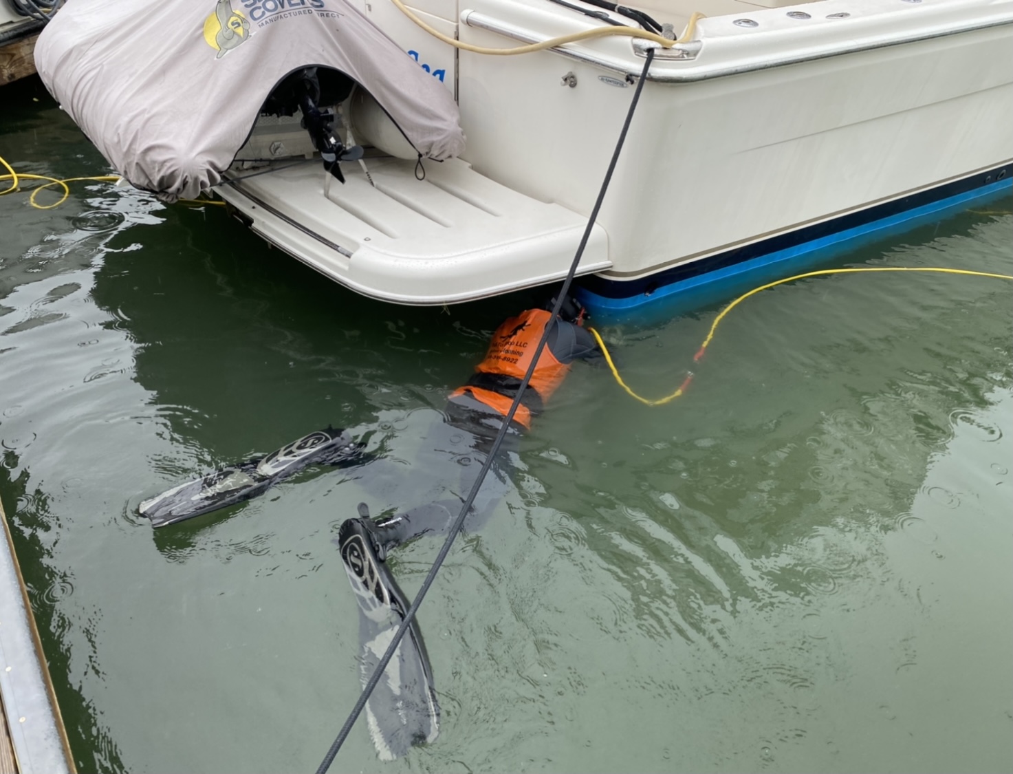 Diver working under boat