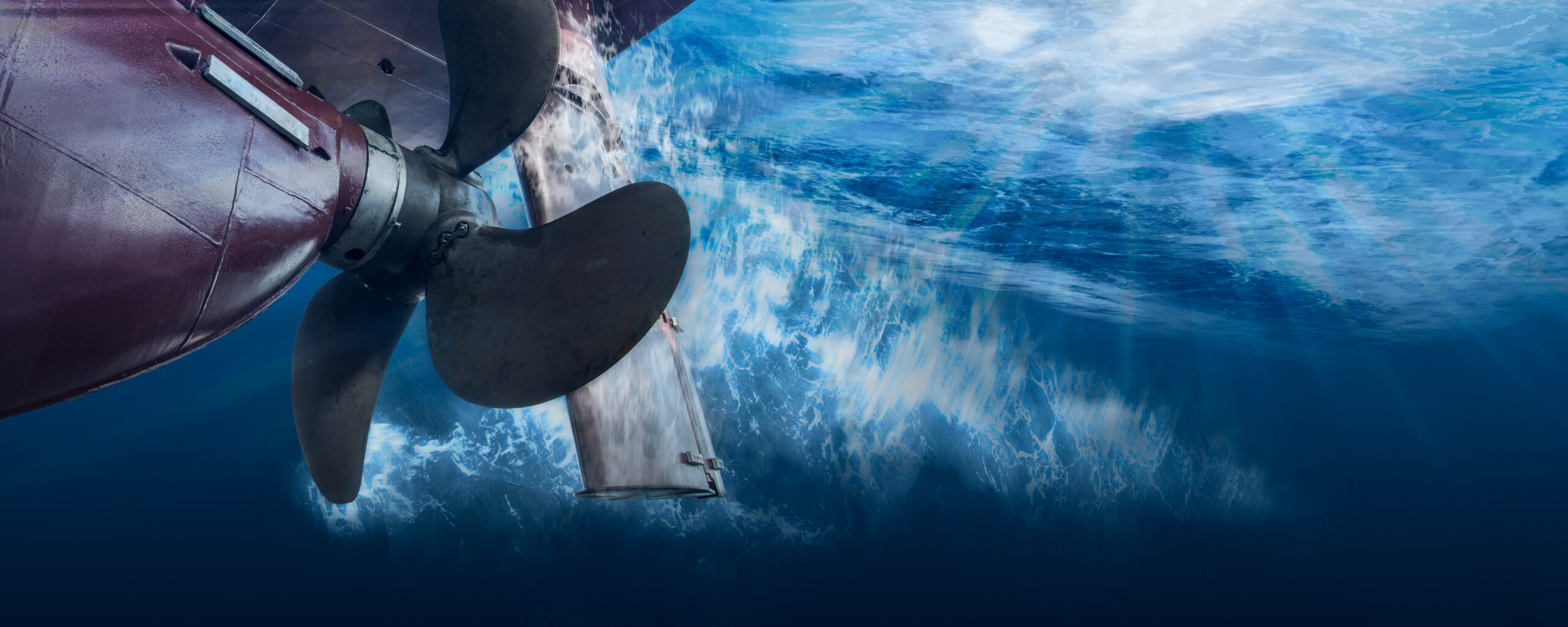Propeller,And,Rudder,Of,Big,Ship,Underway,From,Underwater.,Close