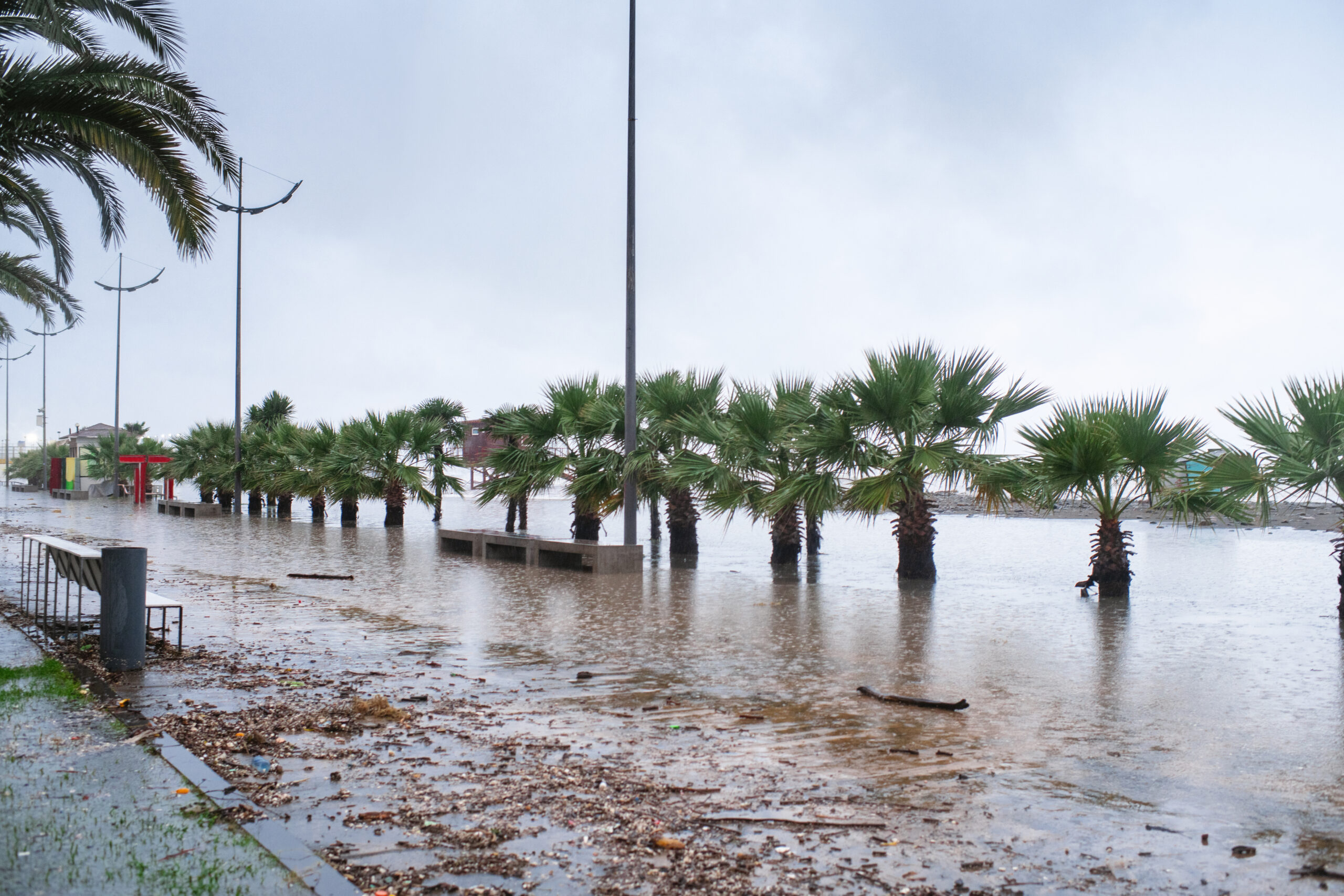 Beach and promenade flooded by sea in a stormy weather